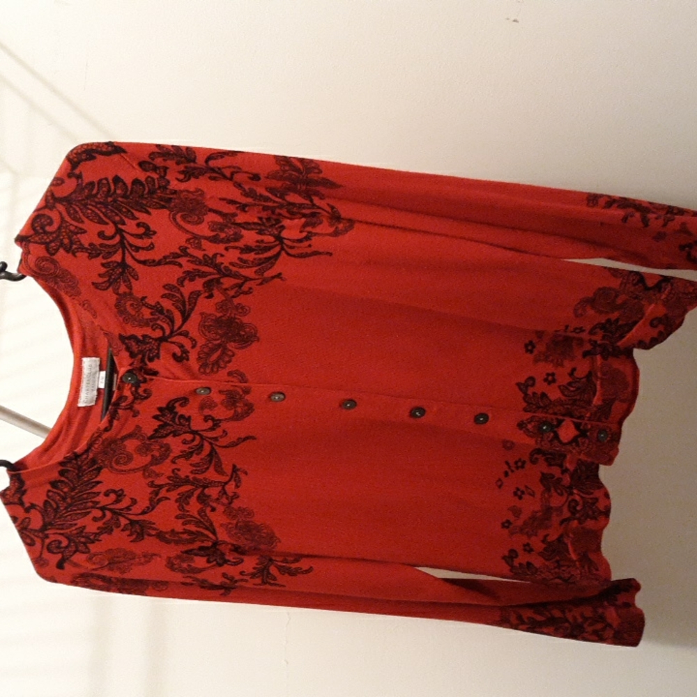 Womens red button up sweater with black details